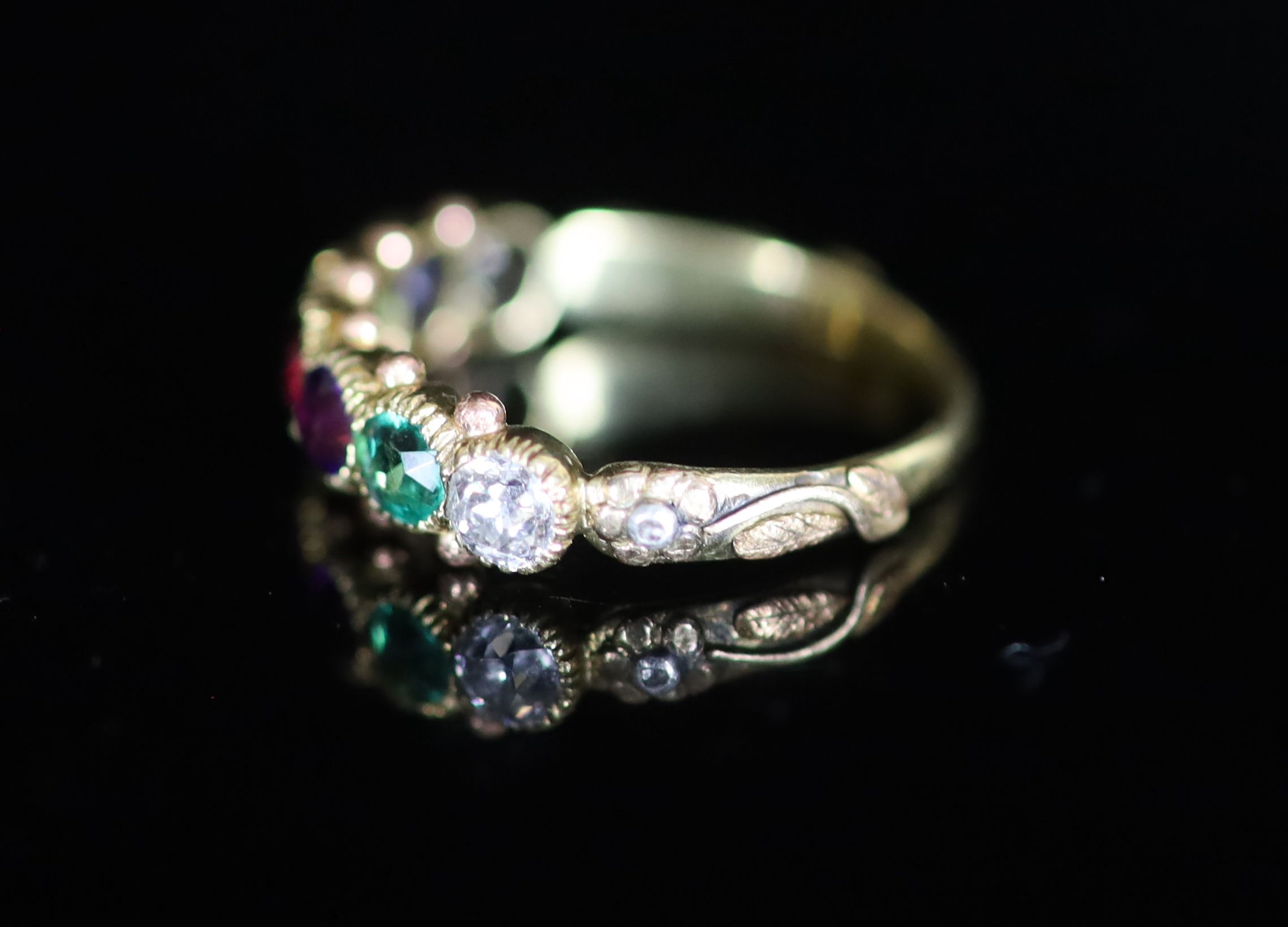 A 19th century gold and multi gem set ‘Dearest’ half hoop ring